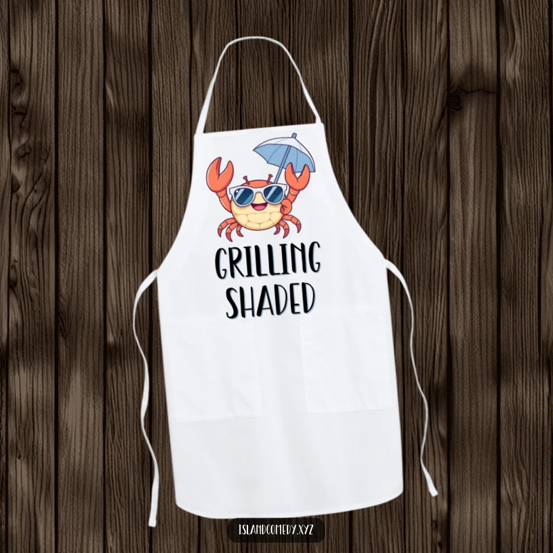 Cheerful crab wearing sunglasses and holding a tiny umbrella apron, a humorous and practical accessory for summer cooking.